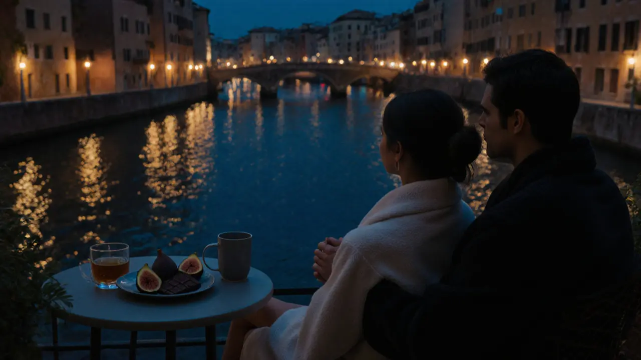 A couple sits silently on a terrace at night, holding hands beside herbal tea and chocolate, with Milan's canal lights reflecting softly in the background.